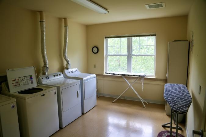 Delaney Hall Residence large shared laundry room with washers and dryers